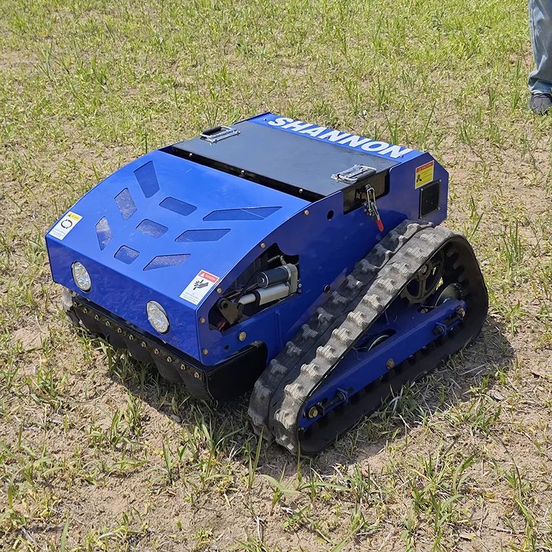 blue-shannon-tracked-lawn-mower-front-side-view-grass-field SN-550IEC Zero Emission Electric Remote Control Lawn Mower