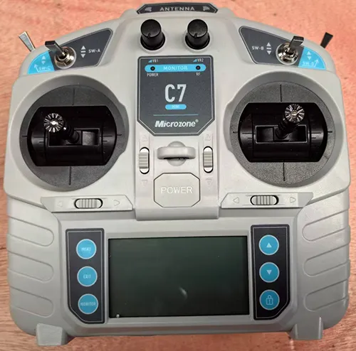 microzone-c7-remote-controller-front-view-wooden-table